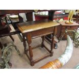 A 17th Century revival oak joint stool on turned leg supports.