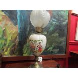 An oil lamp style electric table lamp with frosted moulded shade,