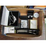A box containing costume jewellery in jewellery boxes