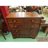 A George III elm and pine chest of four graduating long drawers with fruitwood bun handles over