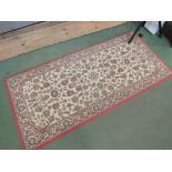 A modern machine woven peach ground rug,