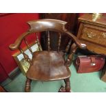 A broad arm oak and elm seat captain's armchair