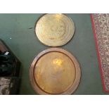 A Middle Eastern brass charger and an Indian charger with elephant design,