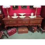 An 18th Century style North Country oak dresser base having mahogany crossbanding,