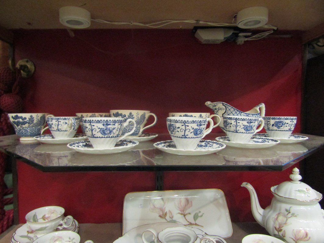 A quantity of Johnson Bros Ironstone coffee wares "Indies" pattern and willow pattern examples,