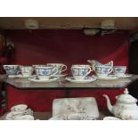 A quantity of Johnson Bros Ironstone coffee wares "Indies" pattern and willow pattern examples,