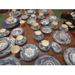 A quantity of blue and white willow pattern tableware and similar