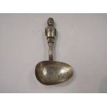 A silver plate nursery spoon as a toy soldier