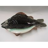 An unusual Victorian Majolica dish modelled as a fish, tail repaired,