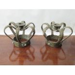 A pair of crown form candle stands,