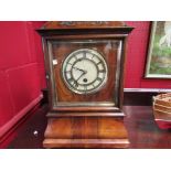 A mantel clock with wooden plates,