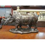 A resin bronze Rhino figure,