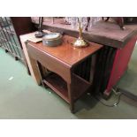 An Edwardian mahogany drop-leaf two tier trolley the galleried under-shelf over later gliding