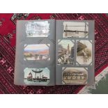 A postcard album containing black and white images of the early 1900's