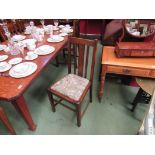 A set of eight oak dining chairs