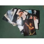 A collection of card photographic prints of pop/ rock/ film stars, including David Bowie,