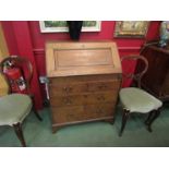 An 18th Century provincial oak bureau with fitted interior,