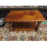 An 18th Century style fruitwood rectangular top occasional table on cannon barrel legs joined by a