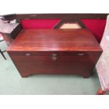 A camphor wood chest with ornate brass clasp on bracket feet (shrinkage split to top) 100cm wide x
