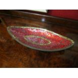 A mosaic and mirrored oval dish in red and gold,