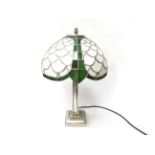 An Art Deco style table lamp with green and white shade,