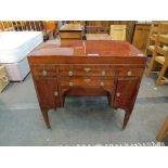 A Regency mahogany washstand, the lift top opening to reveal washbowl space and mirror,