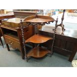A Victorian mahogany corner whatnot with three shaped shelves joined by barley twist supports,
