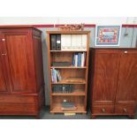 A modern pine tall, open bookcase,