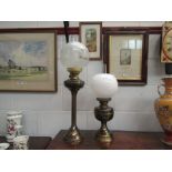 Two brass based oil lamps,