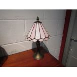 A Tiffany style table lamp with rose pink glass shade,