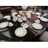 A quantity of Gainsborough dinner and tea wares, white ground with foliate sprays,