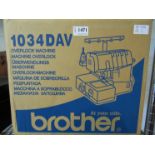 A boxed Brother Overlock sewing machine