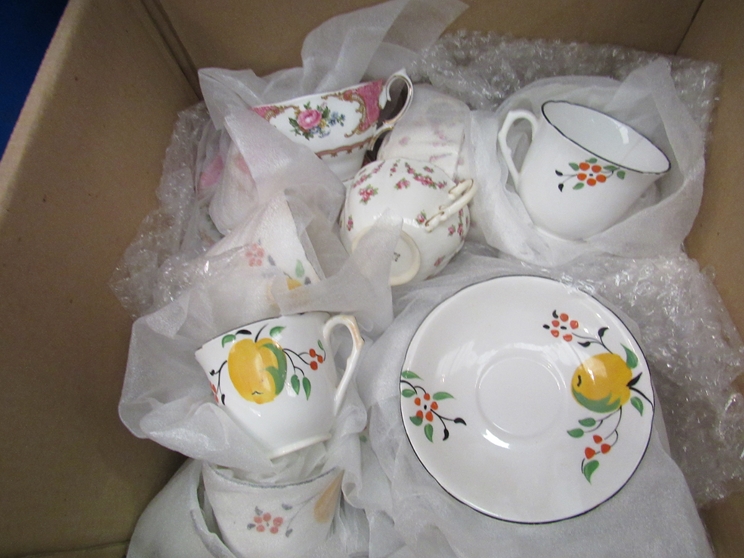 A box of mixed crockery including Crown and Royal Albert "Lady Carlyle" cups and saucers,