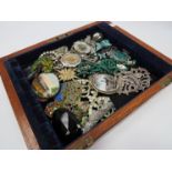 A tray of bijouterie including malachite necklace, buckles,