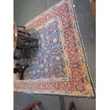 An early 20th Century hand woven Persian rug a/f, worn areas and hole.