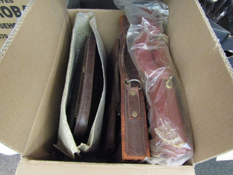 A quantity of leather cases