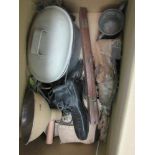 A box of miscellaneous including bygone ice skates, hand-held lamp, boots,
