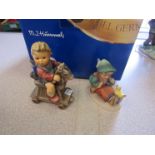 Two boxed Goebel figures,
