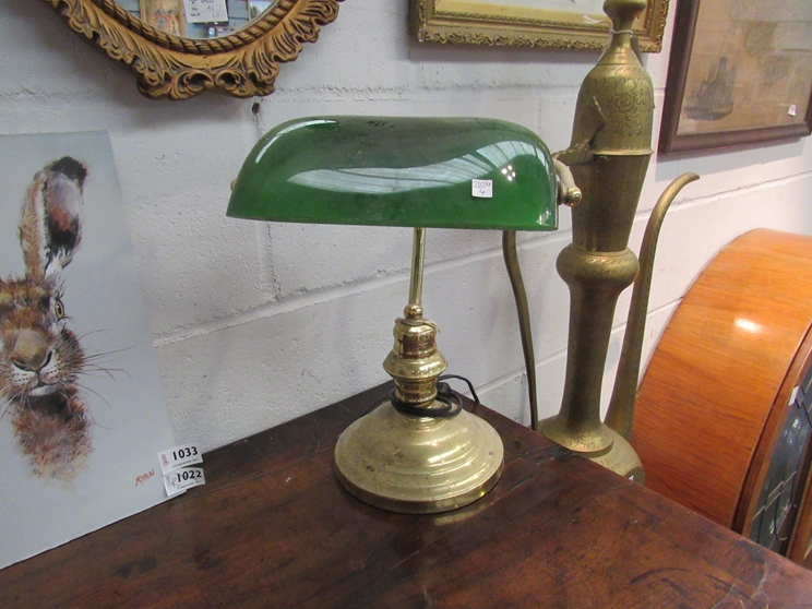 A brass based bankers lamp with green glass shade,