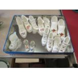A collection of ceramic boots including Royal Albert, Coalport, Limoges,