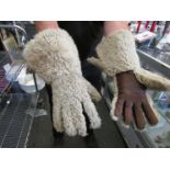 A pair of leather and woolen men's gloves