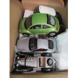 A collection of unboxed Burago 1:18 and 1:24 scale diecast cars including Mini, Jaguar "E" type etc.