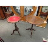 A mahogany wine table with leather insert and another