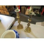 A pair of brass candlesticks