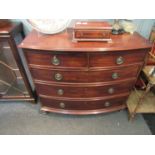A two over three bow front chest of drawers,