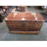 A South African hardwood chest, fold design front and sides, with heavy textured brass fittings,