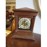 A mahogany mantel clock with Arabic dial,