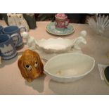 A Sylvac Basset Hound money box together with a cherub and floral table decorated jardiniere and