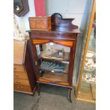 A circa 1920's mahogany and line inlaid display cabinet with raised back,
