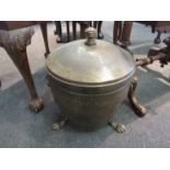 A brass footed coal box